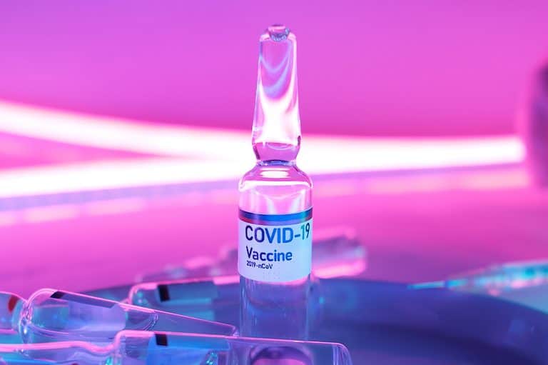 Glass clean ampoule with vaccine for COVID 19