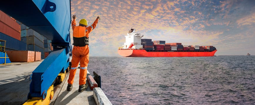 Panorama Container ship vessel departure from the sea port terminal after completion of loading/disc